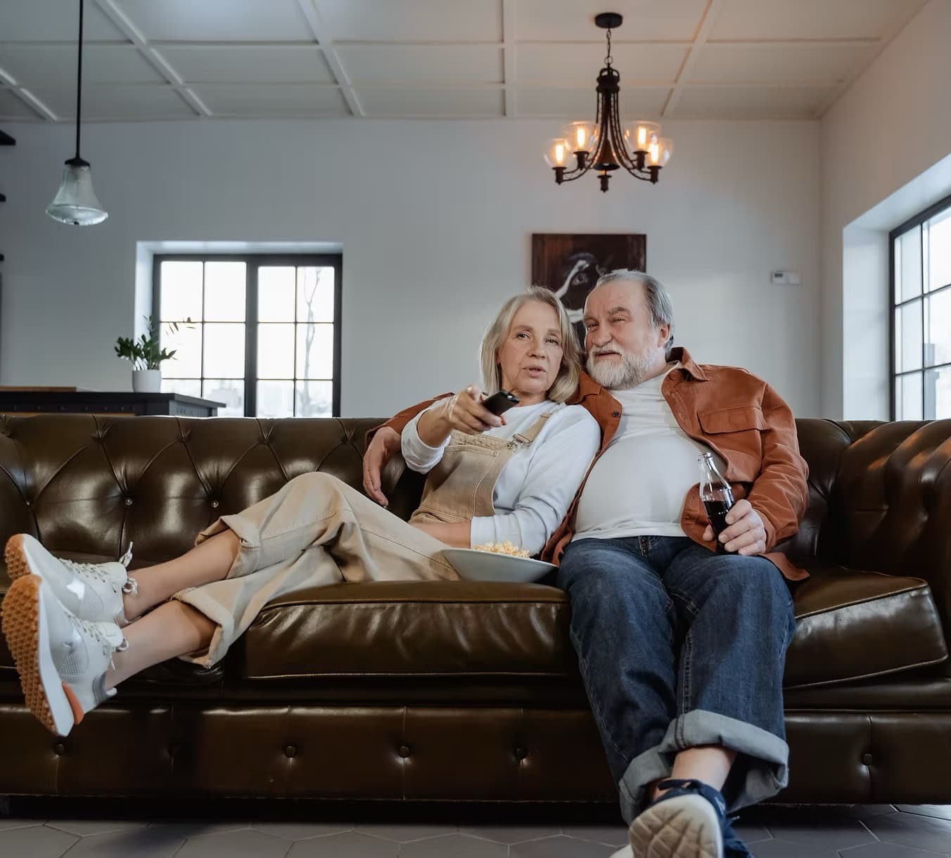 Owners on couch in their occupied home